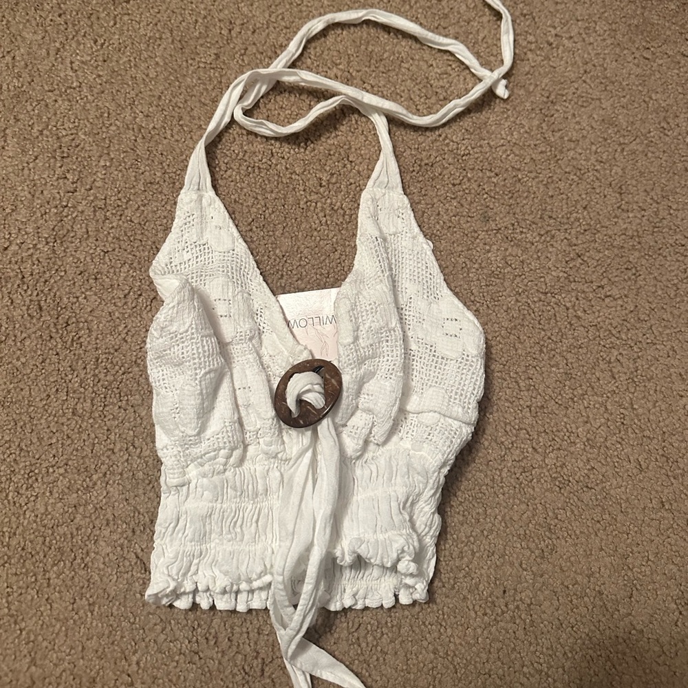 White ring top. Ties around the neck